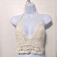 For Size Reference Was Modeled On A Small Mannequin. Brand New With Tag, Perfect Condition. Very Cute Crochet Top In The Shade Ivory. Ties Around The Neck, Laces Across The Middle Of The Back Band, You Can Make It Looser Or Tighter. Size Large, About 14 1/2" Across The Back, But You Can Loosen That Up With The Laces. Pretty Crochet Stitches, The Bust Area Is A Little Tighter Stitched So You Can't See Through It. Great For The Summertime, Or Wear It Now Over A Sheer Bodysuit, Under Another Top Or White Crochet Halter Top For Summer, White Crochet Cotton Halter Top, White Crochet Trim Halter Top For Beach, White Open Knit Crop Top For Beach, White Crochet Halter Top For The Beach, White Crochet Halter Top For Beach, White Crochet Trim Triangle Top, Cream Lace Top With Crochet Trim For Beach, Handmade White Halter Top For Vacation