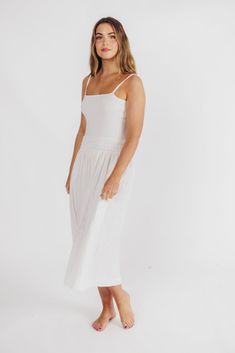 Streamlined and deliciously cool, the Nadia Maxi Dress checks all the boxes! It features a flattering dropped waist with some stretch for extra bodice, plus an elegant square neckline and adjustable straps. Did we mention it has pockets?! Pair with your favorite slides for casual glamour. FIT: Runs true to size. MATERIAL: Self: 100% Cotton; Contrast: 85% Viscose, 15% Nylon. GARMENT DETAILS: Sleeveless, lightweight midi/maxi dress with a stretchy, dropped waist, square neckline, and adjustable spaghetti straps. Finished with dual in-seam pockets and back slit. SIZE GUIDE: XS (0-2) / S (2-4) / M (6-8) / L (10-12) MODEL DETAILS: Mackenzie - Size S Heather - Size S Molly - Size XL Our Brunette Misses Model Our Blonde Misses Model Our Blonde Curve Model Bust 34" 34" 37" Waist 27.5" 27.5" 32" Hi White Midi Dress With Straight Neckline And Adjustable Straps, Casual White Midi Dress With Straight Neckline, White Casual Midi Dress With Straight Neckline, Casual Glamour, Garment Details, Curve Model, Tank Maxi Dress, Maxi Tank Dress, Midi Maxi Dress