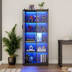 a living room with a book shelf filled with books and toys next to a potted plant