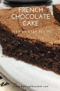 a piece of chocolate cake sitting on top of a white plate with the words french chocolate cake