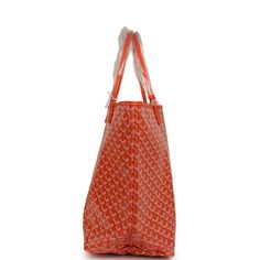 This Goyard St. Louis Tote GM bag is in orange canvas with palladium hardware and has contrast white stitching, and a matching detachable button closure wallet The interior is lined with white canvas.Origin: FranceCondition: New and never worn (plastic on handles)Accompanied by: Goyard dustbag, felt, wallet and retail tagMeasurements: 15.7" x 13" x 7.8"; 8" shoulder strap Orange Travel Bag With Silver-tone Hardware, Luxury Orange Bags With Silver-tone Hardware, Designer Orange Bags For Everyday Use, Designer Orange Everyday Bags, Shopping Bags In Coated Canvas With Silver-tone Hardware, Shopping Bags With Silver-tone Hardware In Coated Canvas, Designer Orange Bag With Leather Handles, Designer Orange Shoulder Bag For Shopping, Orange Bags With Palladium Hardware