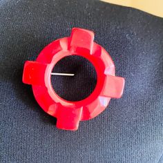 1940s Cherry Red Bakelite Brooch Pin Is Made In The Shape Of A Life Preserver Ring Or Buoy, Likely Created During Ww2 To Represent The Navy. Closes With “C” Clasp Metal Ring. Measures 1 3/4″ In Diameter X Approximately 3/8″ Thick. Very Good Vintage Condition. It Has Two Spots Where There Once Was A Teeny Black & White Leather Braided Rope, In A Past Owner's Life! Rare And Whimsical, It's A True Collector’s Item Life Preserver Ring, Bakelite Brooch, Life Preserver, Braided Rope, Metal Ring, Cherry Red, Metal Rings, Unique Colors, White Leather