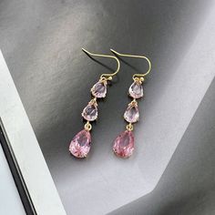 Dainty Pink Crystal Earrings, July Birthstone, Soft Pink Drop Earrings, Wedding Jewelry, Pink Teardrop Earrings, Bridesmaid Gift Earrings. Earrings made from faceted soft pink crystals and gold framed teardrop crystals same color. Matching charm necklace is available for purchase (NOT included with earrings). Measurements: The total length from the top of the hook to bottom - 1.85 inches (47 mm) approximately. Teardrop crystals 14 mm x 8 mm Connector crystals: 6 mm x 8 mm The earrings would be a Chocolate Earrings, Blush Pink Earrings, Drop Earrings Wedding, Pink Drop Earrings, Pink Crystal Earrings, Bridesmaid Gifts Earrings, Pink Chocolate, Rose Pale, Earrings Bridesmaid