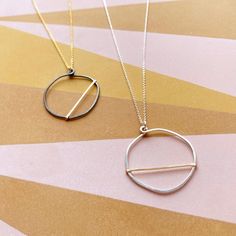 We love how the OPTIMIST necklace has a carefree, positive vibe about it!Each OPTIMIST circle starts out as a piece of sterling silver wire that we hand shape into an organic circle. It is then hammered and reshaped - no two are exactly alike! We then add a contrasting piece of hammered wire asymmetrically.Each pendant comes on our signature dainty cable chain. Necklace Details all components are sterling silver and gold filled available in 16" & 18" (recommended) chain lengths pendant measures Silver Circle Necklace, Minimalist Full Circle Necklace With Delicate Chain, Modern Everyday Necklace With Open Circle, Delicate Chain Necklace For Everyday, Everyday Full Circle Necklace With Delicate Chain, Delicate Full Circle Necklace For Everyday, Minimalist Everyday Hand Forged Necklaces, Everyday Minimalist Hand Forged Necklaces, Handmade Everyday Circle Necklace