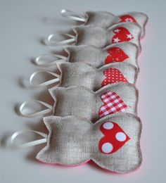 a row of red and white polka dot fabric hair combs with bows on them