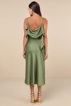 The Tyler McGillivary Thistle Green Multi Satin Cowl Neck Midi Dress is ready to transport you and everyone you meet to a world of whimsy! Glossy woven satin boasts a large-scale thistle print as it shapes adjustable spaghetti straps and a fold-over, cowl neckline and back, with long, twisting sash tendrils at the sides. The figure-skimming bodice continues into a flowy A-line skirt with a chic midi hem. Hidden side zipper. Fit: This garment fits true to size. Length: Mid-calf length. Size mediu Tyler Mcgillivary, Thistle Print, Cowl Neck Midi Dress, Adhesive Bra, Cowl Neckline, Strapless Bra, A Line Skirt, Mid Calf, Cowl Neck