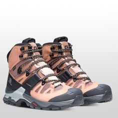 a pair of hiking boots with laces on them