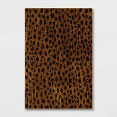 a brown and black animal print on wood