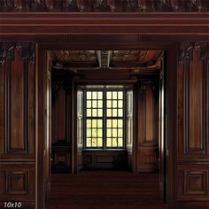 an empty room with wood paneling and windows