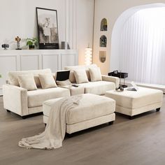 a living room filled with furniture and white walls