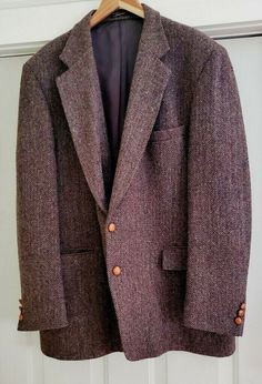 Stunning vintage Harris Tweed blazer in a brown, almost purplish herringbone speckled with various colors - the weave on this is simply extraordinary. Tonal contrast leather buttons to front and sleeves. Two front flap pockets, chest pocket, two interior pockets, single vent in back. In excellent condition to boot - looks like it was barely worn. Just a fantastic blazer. No size tag, so please note the dimensions, which conform to Long sizes for a tall man: Chest: 24” Sleeves: 27" Length, top of Vintage Tweed Jacket For Formal Occasions, Vintage Wool Tweed Jacket With Herringbone Pattern, Man Chest, School Blazer, Men Bodies, Tall Man, Herringbone Blazer, Wardrobe Ideas, Harris Tweed