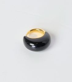 The Khartoum II Ring with Black Onyx Inlay by Khiry is a bold ring crafted in polished 18k Gold Vermeil with a semi-precious, black onyx stone inlay. 18k Polished Gold Vermeil and Black Onyx Inlay Due to the use of precious stones, each ring varies slightly. Formal Black Dome Ring With Polished Finish, Elegant Black Dome Ring With Polished Finish, Modern Black Enamel Rings For Formal Occasions, Modern Black Enamel Rings For Formal Events, Polished Finish Round Ring For Evening, Black Enamel Ring With Polished Finish For Formal Occasions, Modern Black Rings For Formal Occasions, Formal Black Enamel Ring With Polished Finish, Modern Polished Finish Rings For Evening