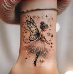 a woman's tattoo with a fairy on her ankle and stars around the ankles