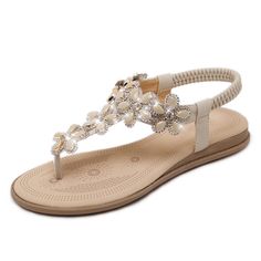 PRICES MAY VARY. 【Material】: High quality PU leather , elastic T-strap , breathable insole and anti-skid rubber sole，stylish & comfortable. 【Design】: Classic, elegant and fashionable flat rhinestone sandals with unique rhinestones & Hand-made colorful bohemian beads Embellishment,to make your feet looks sexy,charming. 【Feature】: Women rhinestone sandals, exquisite sewing technology - Choose high quality flexible twine , perfect hand stitching, pretty and firm. 【Heel Height】:Measures approximatel Shoes 2021, Summer Sandals Flat, Boho Shoes, Flats Shoes Comfortable, Rhinestone Flats, Comfortable Slippers, Casual Slippers, Fashion Sandals, Beach Shoes