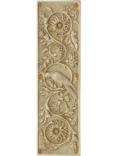 an ornate gold door handle with a bird on it