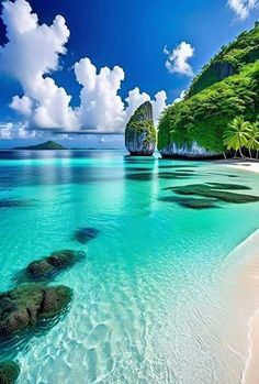 the water is crystal blue and clear with green trees on both sides, and an island in the distance