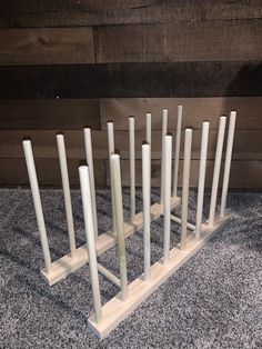 a set of seven white candles sitting on top of a table