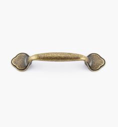 an antique brass door handle on a white background