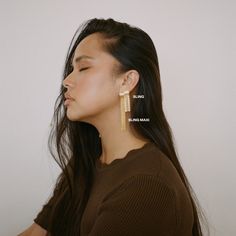 Meet Sling Gold from our Holiday Collection. The perfect pair of tassel earrings to add a bit of spark and energy to your outfits. We recommend wearing it with a sleek back hairstyle. Pair it with Sling Maxi for a dramatic look. Also available in Silver. Sleek Back Hairstyle, Back Hairstyle, Sleek Back, Gold Statement Earrings, Dramatic Look, Earrings In Gold, Elegant Earrings, Holiday Collection, Tassel Earrings