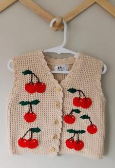 Our Baby/toddler Vest Cardigan is made out of 100% cotton, perfect for keeping your little warm during the winter or autumn months. Add a personalized touch with Embellishments such as flowers 🌺 🌹, cherries 🍒,bows 🎀, polkadots  or a fruit of your choice   To personalize simply state:  1. Embellishment type (eg fruit or bow or flowers etc)  2. Number of Embellishment to add (e.g 3 bows) 3. Location to place Embellishments (back or front OR both) Please feel free to message me if you have any Casual Knitted Cotton Patterns, Casual Cotton Knitted Patterns, Handmade White Cotton Patterns, Cute Knitted Cotton Cardigan, Handmade Cotton Sweater For Fall, Cute Embroidered Cotton Cardigan, Casual Cotton Patterns For Spring, Handmade Cotton Cozy Sweater, Handmade Cotton Cardigan For Fall