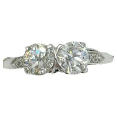 three stone diamond ring with two diamonds on each side