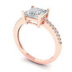 a rose gold engagement ring with a princess cut diamond in the center and side stones