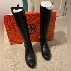 Brand New, Still In Box, Tory Burch Jess Riding Boots In Black Leather. These Are Brand New, Have Never Been Worn, Are In Mint Condition. I Love These Boots, But I Mostly Only Wear Booties So That’s Why I Never Wore Them Out. They Are Gorgeous. No Wear On Bottom. Size: 9 Us Women Color: Black Note That The White Fabric Between The Leather And Metal Is How They Came When Purchased. That Is To Be Taken Out Once You Wear Them. Because They Are Brand New And Have Never Been Worn Is Why They Are Stil Boots Tory Burch, Tory Burch Shoes, White Fabric, White Fabrics, Woman Colour, Shoe Brands, Riding Boots, Mint Condition, The White