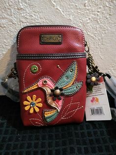 Chala - Hummingbird on Burgundy - Cellphone Crossbody Handbag. Chala Purses Handbags, Casual Red Portable Phone Bag, Red Casual Phone Bag, Casual Red Phone Bag For Daily Use, Casual Red Phone Bag With Removable Pouch, Casual Red Phone Bag With Adjustable Strap, Casual Red Bag With Cell Phone Pocket, Frame House, A Frame House