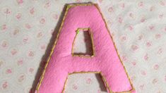 the letters are made out of pink felt