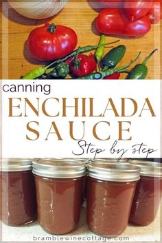 canning enchilada sauce in jars on a table with tomatoes, peppers and garlic