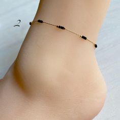 "Beaded ankle bracelet in three styles. Dainty chain with tiny beads. Gold plated brass chain. Chain length: 8.5\" Extension: 1.75\"" Summer Gift Beaded Chain Anklets, Summer Gift Anklets With Gold Beads, Adjustable Beaded Chain Anklet As Gift, Beaded Bracelet Anklet As Gift, Minimalist Anklet With Satellite Chain As Gift, Dainty Beaded Chain Anklets With Round Beads, Minimalist Satellite Chain Anklet As Gift, Minimalist Anklets With Round Beads For Gift, Minimalist Round Bead Anklets As Gift