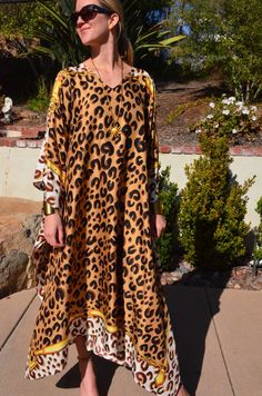 Striking silk  caftan with brown leopard  print on a gold background is truly spectacular for any occasion.   One size.  Fits many sizes from small ti X large .  The width is 52 inches from edge to edge and the length is 51 inches. Gold Kaftan For Summer Vacation, Gold Bohemian Kaftan For The Beach, Silk Dress Beach, Long Silk Dress, Silk Caftan, Coverup Beach, Silk Kaftan, Silk Dress Long, Dress Beach