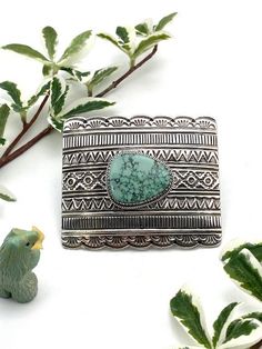 Here is a gift for anyone that wears a belt, even you. This is a great belt buckle. It is solid, heavy sterling silver with a 1 1/2 inch fixed loop made of sterling silver and a sterling tang. The beautiful and interesting cabochon is Emerald Valley turquoise from Nevada. The belt buckle is Navajo handmade with rows of interesting stamp work and a handmade saw cut bezel that adds even more style and class to an already classy buckle. The buckle is 3 inches wide by 2 1/2 inches deep, so is an app Silver Belt Buckle, Silver Belts, Turquoise Bracelet Cuff, Royston Turquoise, Turquoise Cuff, Silver Band Ring, Green Turquoise, Natural Turquoise, Sterling Silver Bands