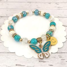 "Butterfly Bracelet, Enamel Butterfly Charm Bracelet,  Turquoise Bracelet, Personalized Gifts, Butterfly Jewelry for Girls, Butterfly Gifts ----- This beaded turquoise stretch bracelet is made with pearlescent beads and features a cute turquoise and gold enamel butterfly charm!  Add an initial to make this a special gift for a little girl. INCLUDES: 🌸 One pearlescent turquoise colored beaded bracelet with butterfly charm SIZE & MATERIALS: 🌸 Standard size:  6\" {If you need a different size, re Bohemian Blue Personalized Friendship Bracelets, Turquoise Beaded Charm Bracelet For Gift, White Butterfly Charm Bracelet For Gift, Turquoise Beaded Charm Bracelet Gift, Adjustable Personalized Turquoise Friendship Bracelets, Turquoise Beaded Stretch Bracelet Gift, Personalized Blue Bohemian Beaded Bracelets, Personalized Green Bohemian Bracelets, Bohemian Light Blue Bracelets For Jewelry Making