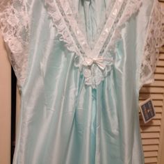 Gilligan O'malley Beautiful Night Gown Trimmed With Lace. Pale Aqua Blue With White Lace, At Neckline, Bodice, Sleeves And Hem Line. Size Is Small. 100 % Polyester, But The Look And Feel Of Satin. Hemline Is A Semi-Circle Style, Forming A V Design. Length Is 47 Inches At Center. Simply Beautiful ! ! New With Tags. Blue Satin Nightgown For Wedding Night, Blue Sleepwear For Wedding Night In Spring, Light Blue Sleepwear For Wedding Night In Spring, Blue Satin Nightgown For Bedtime, Beautiful Nightgown, V Design, Pale Aqua, Linen Fashion, Beautiful Night