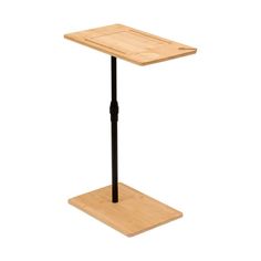 a small wooden table with a black metal base and two legs on each side, against a white background