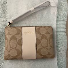 Brand New Never Used Cream Coach Wristlet. Coach Wristlet Aesthetic, Beige Clutch With Wrist Strap For Gift, Beige Clutch With Wrist Strap As Gift, Chic Wristlet With Zipper Closure For Gift, Chic Coach Wristlet With Zipper Closure, Coach Beige Pouch Wristlet, Beige Coach Pouch Wristlet, Beige Clutch Wristlet With Zipper, Beige Wristlet Clutch With Zipper Closure