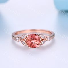 1.2ct Round Cut Padparadscha Sapphire Ring,Marquise Shaped Moissanite Ring,14k Rose Gold,Sapphire Promise Ring,Anniversary Gift For Women You are looking at a Paparacha Sapphire Engagement Ring,band stone is moisanite. A perfect anniversary gift, birthday gift,wedding engagement ring.Great as a gift for her. Ring Information Main Stone * Paparacha Sapphire  *7mm round cut *Weight:it's approx 1.2 ctw. *Setting:8-prong Stone On the Band *3x1.5mm marquise moisanite Metal *925 sterling silver, * Solid 10k 14k &18k. *Color:white gold,yellow gold,rose gold. Custom Order *The main stone can be other gemstones you can imagine,any birthstone can be made.Please contact me if you need this service. *Any size *I can also design the matching band. Other *Rush order *Engraving *Payment plans Processing Padparadscha Engagement Ring, Padparadscha Sapphire Engagement Ring, Engraved Band Engagement Ring, Padparadscha Sapphire Ring, Colored Stone Engagement Rings, Peach Sapphire Engagement Ring, Pink Engagement Ring, Nature Inspired Engagement Ring, Dainty Engagement Rings