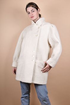 "90s elegant white wool coat. M E A S U R E M E N T S - taken seam to seam lying flat - not doubled Armpit to armpit 21,5\"/55 cm Length 33\"/83 cm Sleeve 24\"/61 cm Shoulder to Shoulder: 19,5\"/49 cm L size In good vintage condition Made of 18% mohair wool, 56% wool, 26% viscose You will receive the exact item shown in the picture." White Wool Coat For Winter, White Wool Long Coat, White Long Wool Coat For Fall, Cream Wool Coat With Button Closure For Fall, White Classic Wool Coat, Classic White Wool Coat, Cream Wool Coat With Button Closure, Classic White Wool Outerwear, Fitted Winter White Wool Outerwear