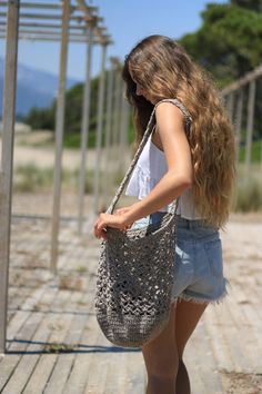 Taupe crochet bag. Shoulder bag for work or play. This handmade bag is perfect for a day at the beach. Pack up your towel, sun screen, book, magazines, don't forget snacks and water. This tote can carry it all and more. Tassel is removable and you can choose your favorite colors! I've crochet this bag with two strands of yarn, one cotton the other cotton viscose. It is strong yet feminine. The shoulder strap is wide for comfort. This bag is not lined Color: Taupe (OUT OF STOCK) Also available in Large Crochet Bag, Summer Bag Crochet, Faux Fur Bolero, Royal Blue Cardigan, Crochet Crossbody Bag, Boho Purse, Sun Screen, Faux Fur Sweater, Purse Handmade