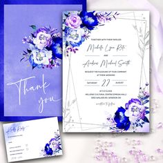 a wedding card with purple flowers on it