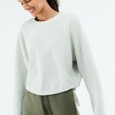 Fabletics Anna Tie-Back Sweatshirt, Xs Light Gray $89.95 Your Favorite Tie-Back Sweatshirt Has A New, Versatile Look. Textured Waffle Fabric Updated Style Features A Drawcord That Goes Around Your Entire Waistto Cinch Or Let Out As You Please. Moisture-wicking Athleisure Top For Loungewear, Athleisure Moisture-wicking Lounge Top, Spring Sportswear Tops For Loungewear, Spring Athleisure Sweats, Spring Workout Sweats, Spring Activewear For Loungewear, Moisture-wicking Athleisure Sweatshirt For Loungewear, Relaxed Fit Sportswear Sweatshirt For Workout, Sporty Relaxed Fit Sweats For Workout