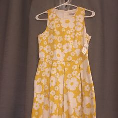 Yellow Flowered Dress That Can Be Worn To Work Or A Party. It Is So Much Cuter In Person And On. Brand New With The Tags. Elegant Yellow Floral Dress For Garden Party, Yellow Floral Dress For Garden Party, Spring Yellow Floral Party Dress, Elegant Yellow Floral Summer Dress, Yellow Floral Sundress For Spring, Yellow Floral Dress For Spring, Yellow Floral Sundress For Garden Party, Yellow Knee-length Floral Dress, Yellow Floral Print Mini Dress For Spring