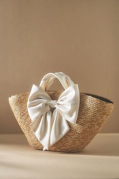 Straw, satin Bow styling Imported | Carlotta Tote by Eugenia Kim in Beige, Women's, Straw/Satin at Anthropologie Japanese School Supplies, Kids School Supplies, Mom Show, Different Hats, Straw Tote Bag, Beige Bag, Eugenia Kim, Straw Tote, School Essentials