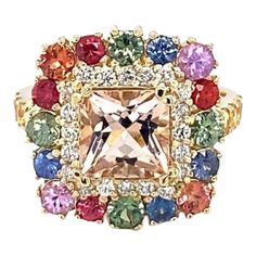 4.05 Carat Morganite Sapphire Diamond Yellow Gold Cocktail Ring  Item Specs:  Morganite (Princess Cut) = 1.71 carats 24 Multi-Color Sapphires (Round Cut) = 2.04 carats 20 Round Cut Diamonds = 0.30 carats (Clarity: SI1, Color: F) 14K Yellow Gold = 5.6 grams Total Carat Weight = 4.05 carats Ring Size = 7 (complimentary ring sizing available)  Exact dimensions for this item are unknown. Please reach out in the seller Q&A for any questions on measurements. Formal Multicolor Diamond Gemstones, Luxury Multicolor Diamond Ring For Anniversary, Luxury Multi-stone Cluster Sapphire Ring, Multicolor Brilliant Cut Sapphire Ring For Formal Occasions, Elegant Multicolor Brilliant Cut Gemstones, Luxury Multi-stone Cushion Cut Ring, Luxury Multicolor Sapphire Ring For Formal Occasions, Multicolor Elegant Diamond Ring For Formal Occasions, Elegant Multicolor Diamond Ring For Formal Occasions