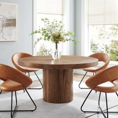 a round wooden table with four chairs around it