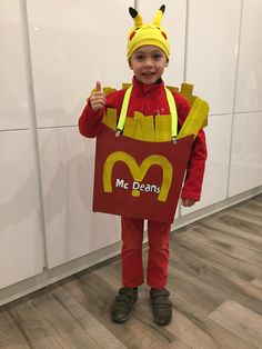 a young boy dressed up as a mcdonald's character