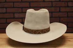 Inspired by the tall crown hat John Wayne wore in his last Western The Shootist (1976) Handmade to Order Crown: Front 6-1/4", Back: 6" Color: Bone (Also available in Granite) Brim: 4-1/2" raw w/slight upturn on sides Hatband: 1-1/4" snakeskin hatband Estimated delivery 8-12 weeks * Disclaimer: "The Shootist", is TM and © (or copyright) by Paramount Pictures. Any reproduction, duplication or distribution of these materials in any form is prohibited. This web site, its operators, including, but no Tall Crown, Los Angeles Street, Color Bone, Crown Hat, Western Hats, John Wayne, Paramount Pictures, 12 Weeks, Hat Band