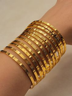 "Metal: 21ct Gold filled on brass.  2 1/2\" inside diameter.  Fits wrists: 7.85 inches circumference. please confirm your wrist size TIP: use string to wrap around your wrist, mark where the string meets, then lay on ruler.  Weight: 0.58 oz  Gold filled is made of two layers that are mechanically bonded to each other: gold (5%) and jeweler's brass (95%). Since gold filled is mechanically bonded onto the base metal instead of plated, the gold doesn't rub off, and it has 100x more gold than gold plated.  Gold filled is tarnish resistant and perfect for everyday wear; you can go to the gym, shower, and sleep in it. It's also hypoallergenic, so it's great for people who have sensitive skin." Banana For Hair, Antique Bridal Jewelry, Handmade Gold Jewellery, Bridal Bangles, Gold Bangles Design, India Jewelry, Gold Necklace Designs, Bangle Designs, Gold Earrings Designs