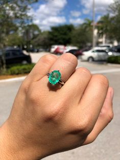 Displayed is a classic solitaire engagement ring in 14K white gold. This gorgeous solitaire ring carries a full 3.70-carat emerald in a six-prong setting. This large gemstone is fully faceted and has excellent shine. This emerald is very clean to the eye for its 3+cts size although minor flaws are present in this natural emerald. Healthy medium green color and radiating luster are noted from this fine gem. Such a simple yet stunning setting that highlights the extraordinary emerald. This ring ca Oval Emerald Ring In 14k White Gold, Classic White Gold Emerald Ring For Proposal, Classic Emerald Ring For Proposal, Oval Emerald Ring With Diamond For Proposal, Oval Emerald Solitaire Ring With Diamond, Gia Certified Sterling Silver Oval Wedding Ring, Oval Emerald Ring With Prong Setting For Proposal, Platinum Solitaire Jewelry For Proposal, Oval Emerald Ring For Proposal